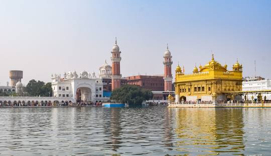 Golden Temple illuminated at night in Amritsar for Him Yatra Travel tour packages