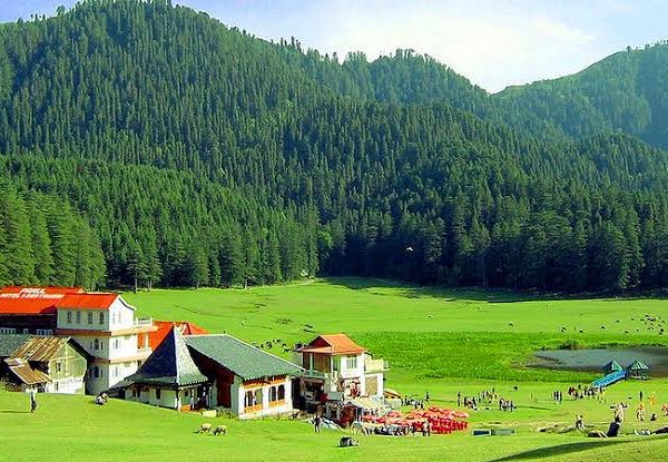 Lush green meadow of Khajjiar near Dalhousie for Him Yatra Travel tour packages