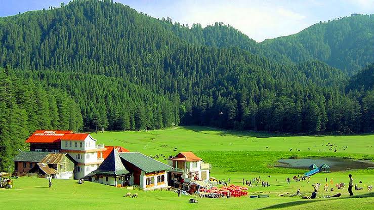 Lush green meadow of Khajjiar near Dalhousie for Him Yatra Travel tour packages